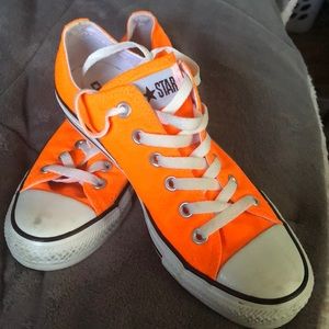 Size 8 women’s or 6 men’s orange converse
